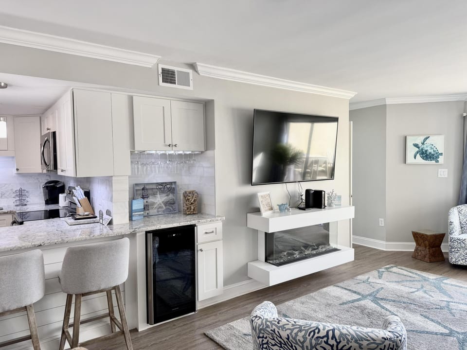 Bright and cozy living room with modern amenities and bar seating