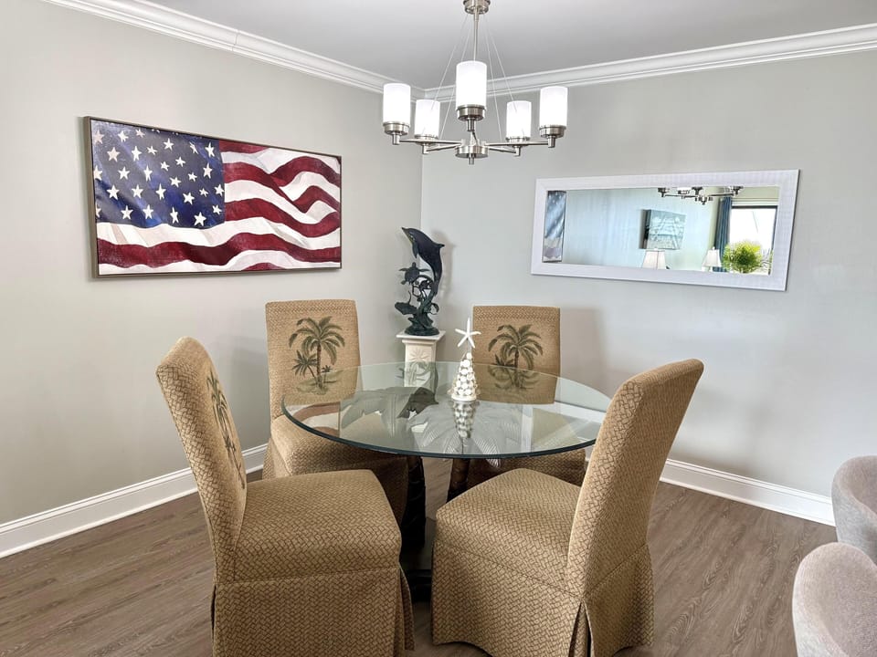 Cozy dining area with patriotic art and natural light
