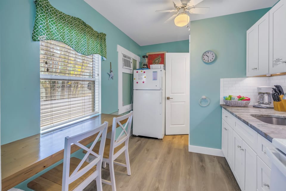 Start your day with coffee and sunshine in this charming kitchen nook.