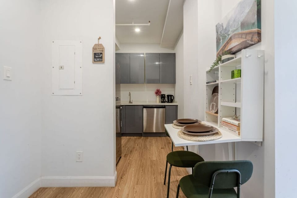 Compact dining nook set against a streamlined kitchen—ideal for quick bites or takeout nights