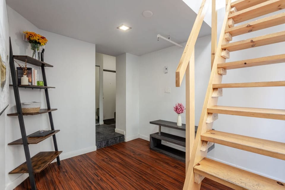 Inviting entry with clever storage, wood details, and bright open flow