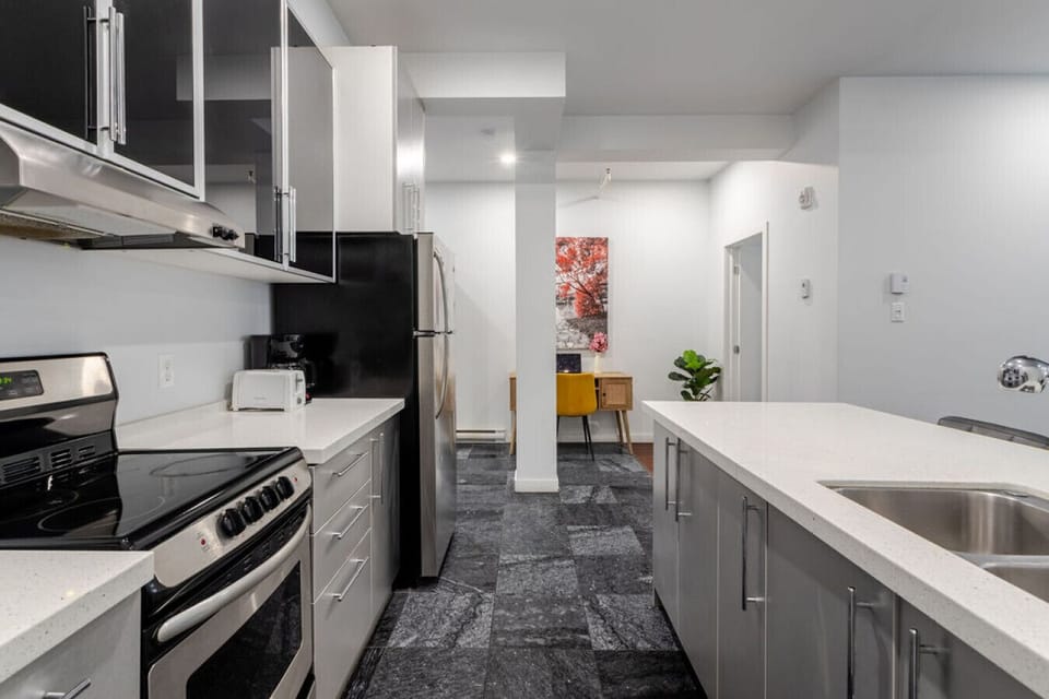 Bright and functional layout with a full kitchen, ample counter space, and open flow to the living area