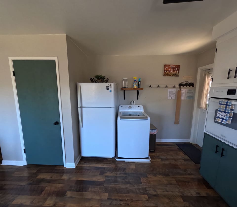 Washer and fridge for added cabin convenience.