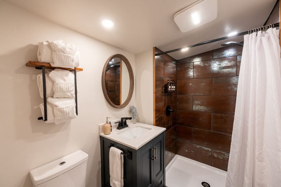 Bathroom with walk in shower and luxury bath amenities