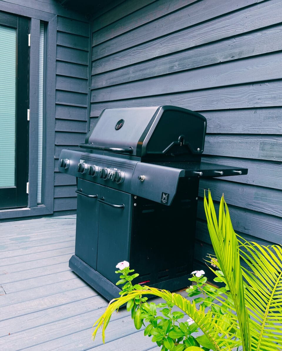 Outdoor gas grill on deck