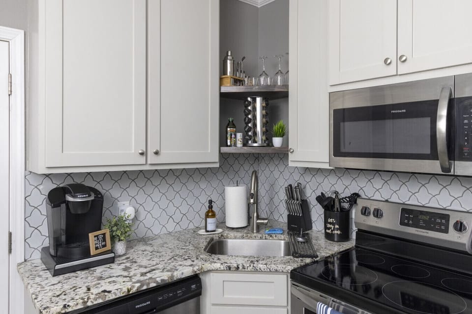 Kitchen Delight: Sleek granite countertops and modern appliances await your culinary creations!