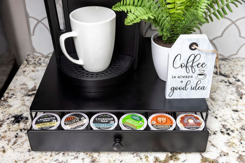 Fuel your day with complimentary coffee essentials — featuring a coffee maker, ground coffee, sweeteners, and mugs to kickstart your mornings with the perfect brew.