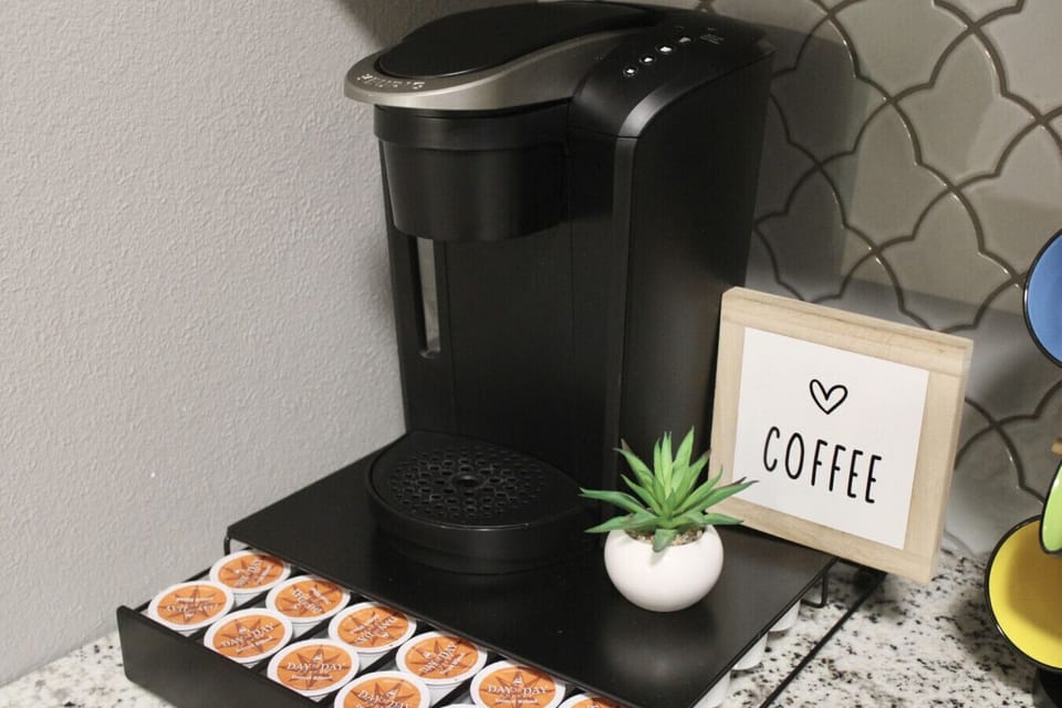Coffee Corner: Brew your perfect cup with a sleek machine and complimentary pods for ultimate comfort!