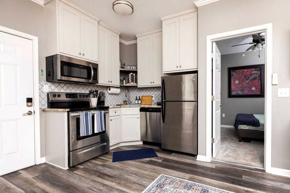 Whether it`s breakfast or dinner, our full kitchen is ready with stainless steel appliances — including a fridge/freezer, stove, oven, microwave, and dishwasher — so you can feel at home while you`re away.