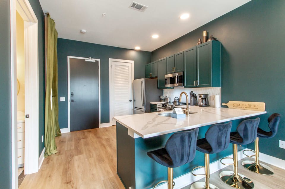 Cook up a storm in this stylish, modern kitchen with elegant accents!