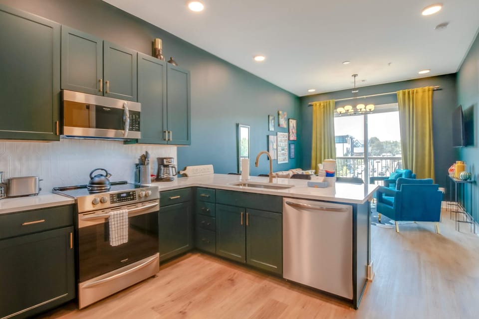Culinary adventures await in this stylish, light-filled kitchen with vibrant decor!