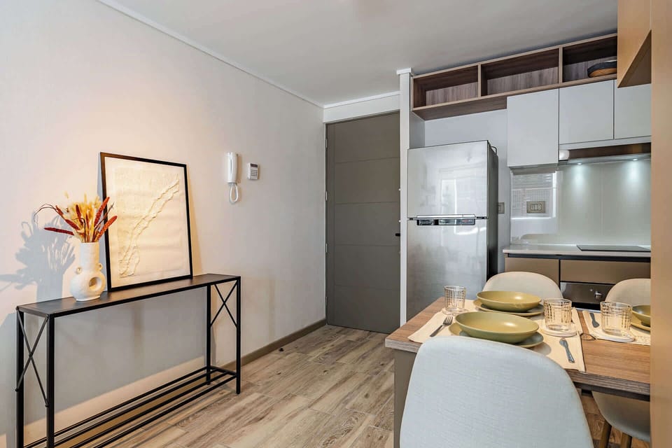 Cozy kitchen nook with modern amenities and stylish decor, perfect for intimate meals.