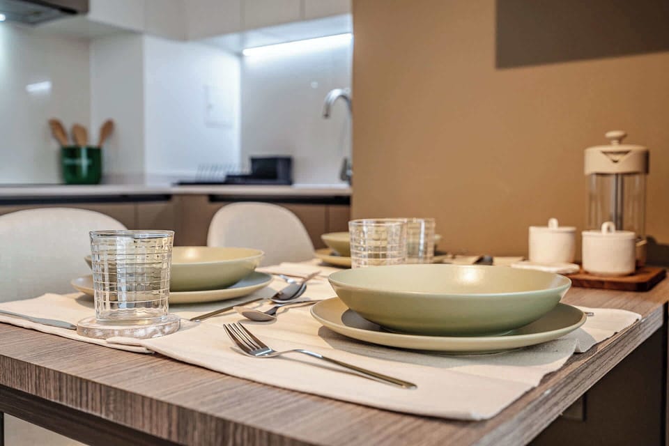 Enjoy a cozy meal in this stylish dining area with modern kitchen amenities.