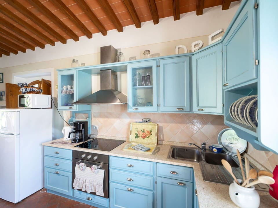 Blue, Furniture, Kitchen, Interior Design, Cabinetry, Wood, Kitchen Appliance, Countertop, Flooring, Major Appliance