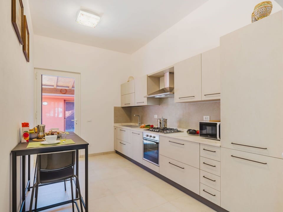 Interior Design, Flooring, Countertop, Furniture, Kitchen, Floor, Kitchen Appliance, Ceiling, Cabinetry, Major Appliance