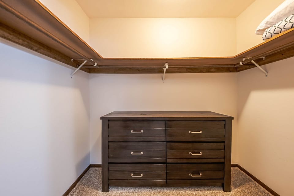 Cozy bedroom featuring a comfortable full bed and closet space