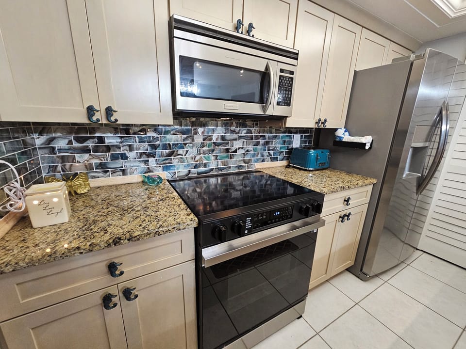 New stainless steel stove and appliances in the kitchen