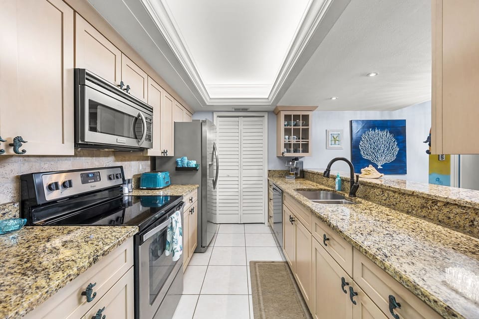 Spacious and fully stocked with stainless steel appliances.