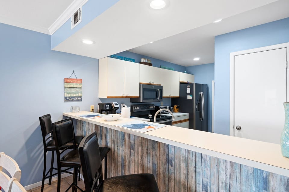 Modern kitchen with a breakfast bar and seating for casual dining