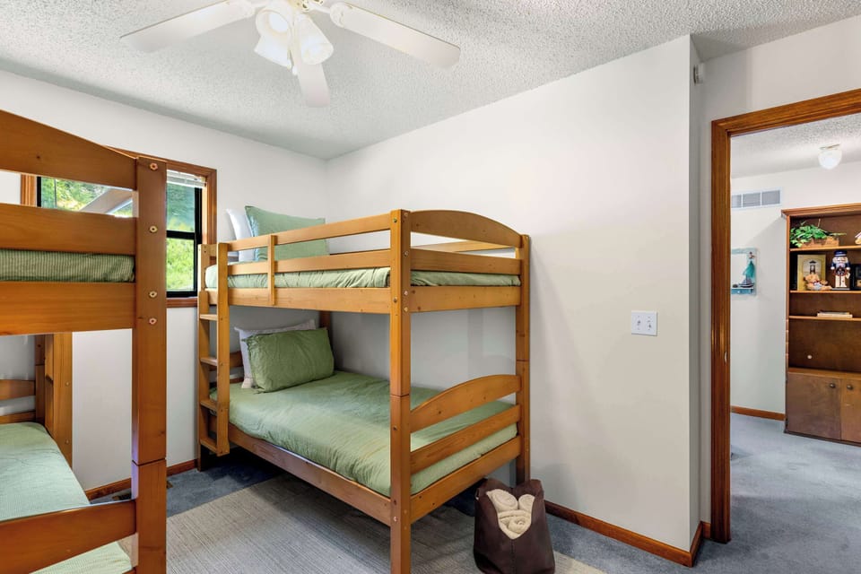The final bedroom includes a smart TV & two twin-over-twin bunkbeds
