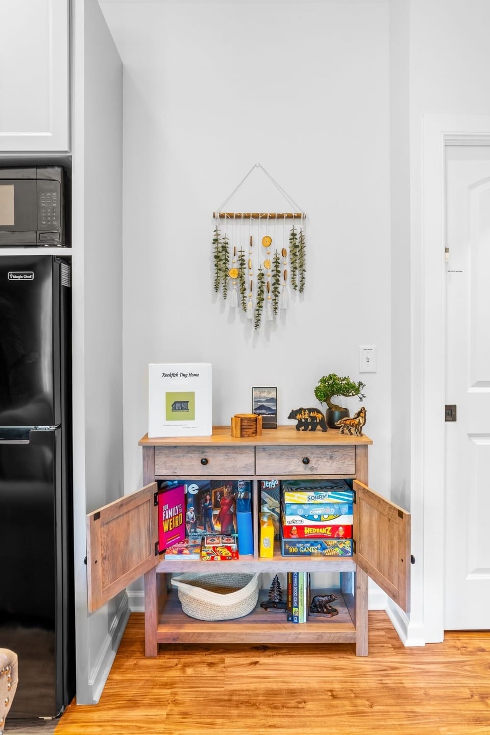 Cabinet with included board games and card games.