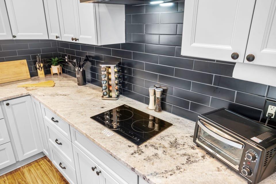 Two burner stove top and toaster oven for all cooking needs.