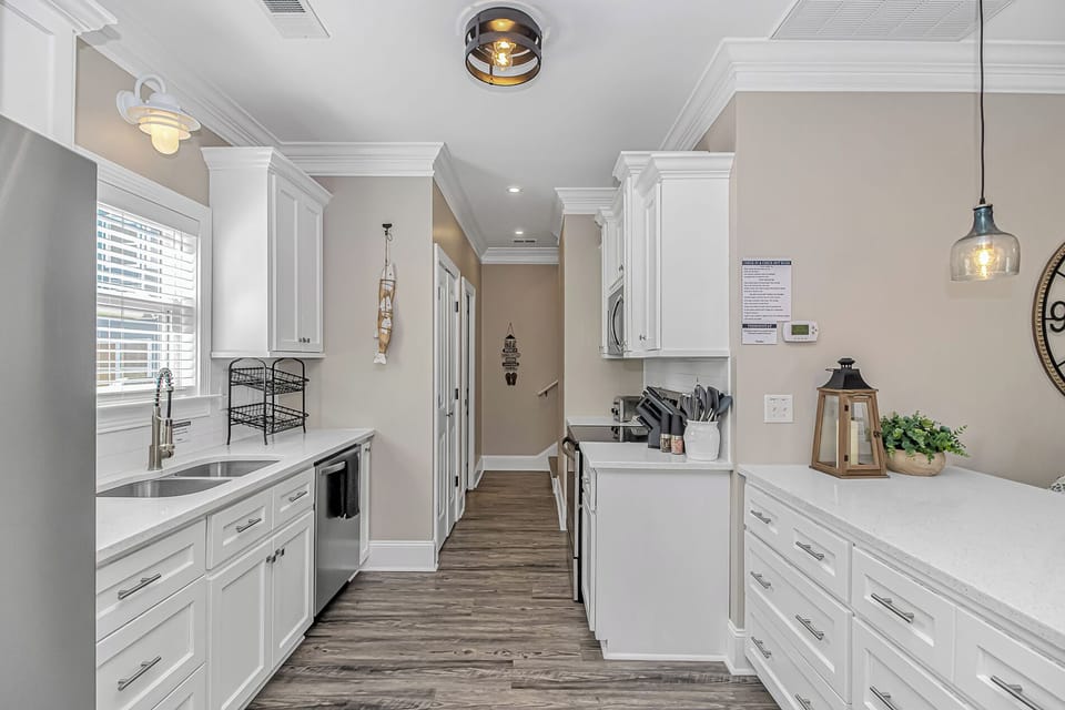 Kitchen leading to upstairs hallway