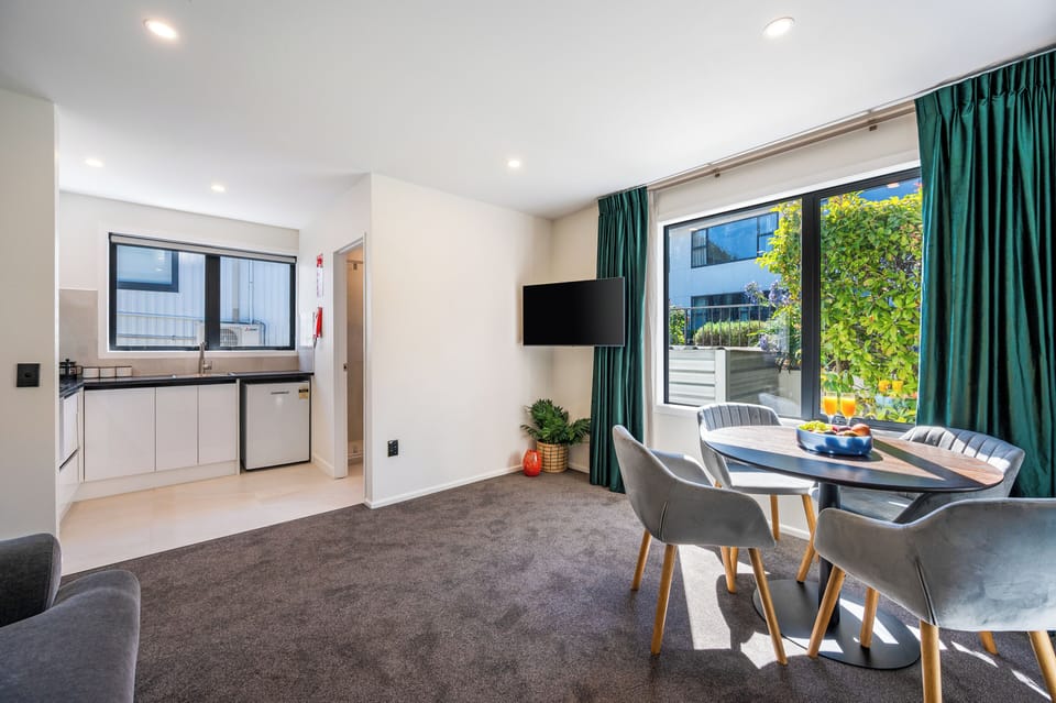 Luxury Suite, 2 Bedrooms | Living area | 43-inch Smart TV with cable channels