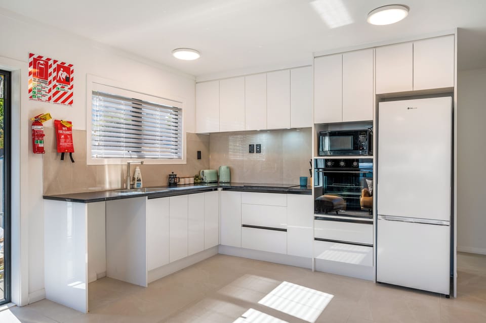 Luxury Suite, 2 Bedrooms, Garden View | Private kitchen | Mini-fridge, microwave, electric kettle, toaster