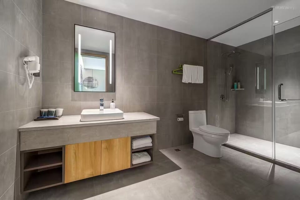 Family Triple Room | Bathroom | Shower, hair dryer, slippers, towels