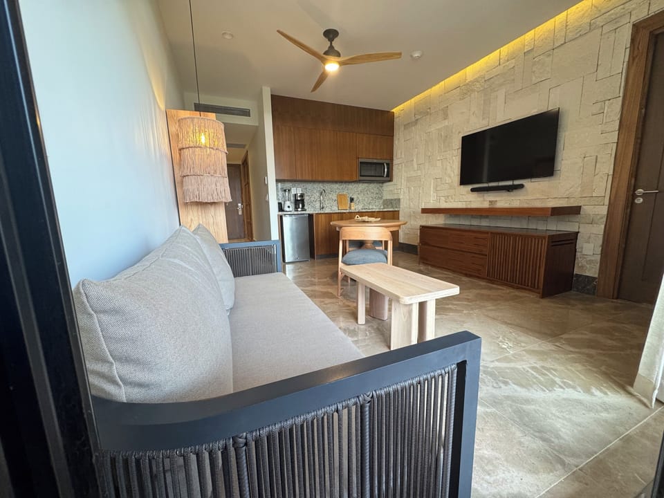 Presidential Suite | Living area | 55-inch flat-screen TV with cable channels, foosball, table tennis