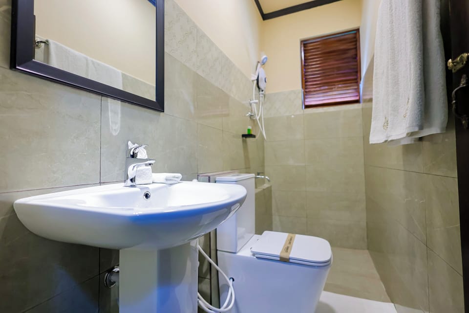 Family Quadruple Room, 2 Bedrooms, Air conditioning, Garden View | Bathroom | Shower, rainfall showerhead, free toiletries, hair dryer