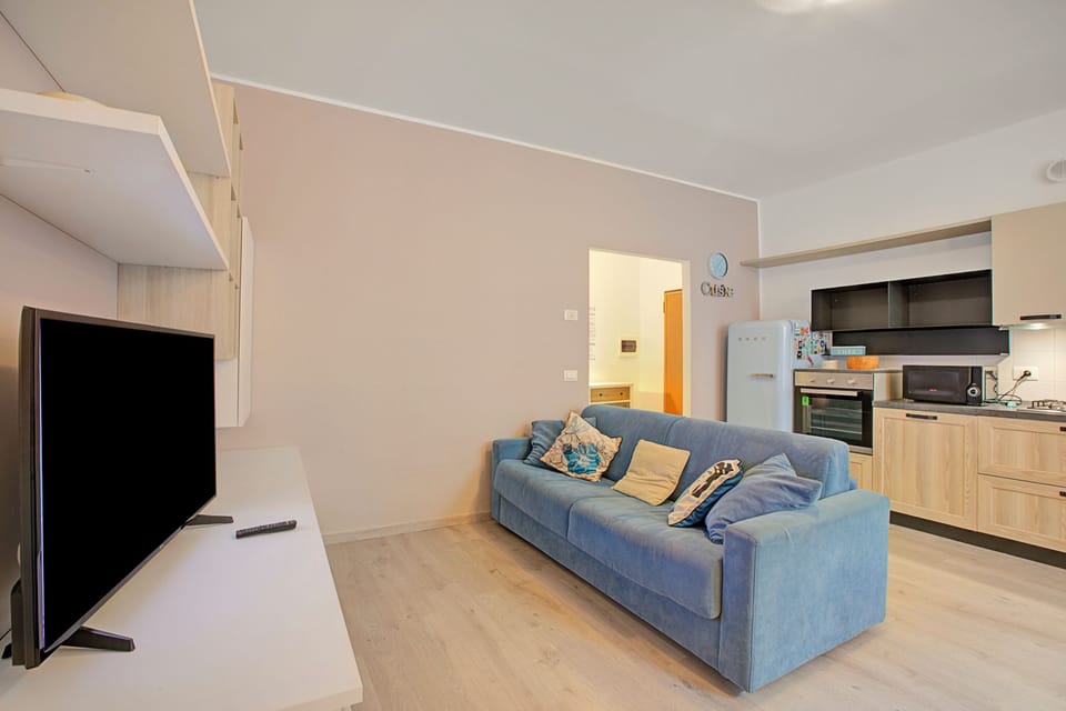 Family Apartment, Multiple Bedrooms (Riva Nest) | Living area | 21-inch TV with cable channels