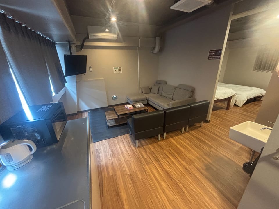 Comfort Quadruple Room | Living area