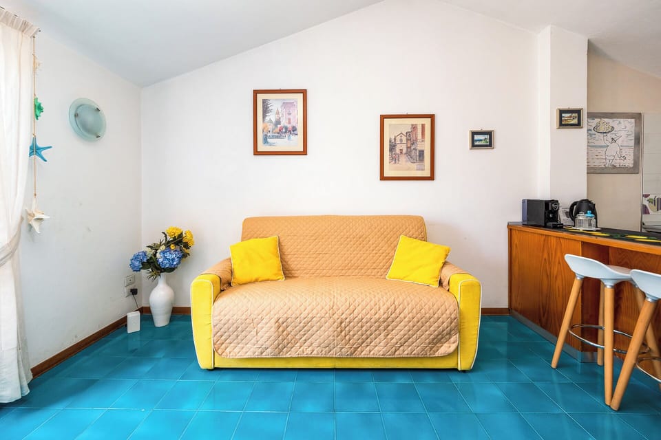 Panoramic Apartment, Partial Sea View | Living area | 30-inch flat-screen TV with digital channels
