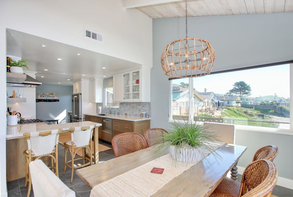 Coastal gourmet kitchen, completely remodeled in 2026 and equipped with chef-grade appliances, granite countertops, and custom cabinetry. Designed for both style and function, this bright and airy space is fully stocked with everything you need to prepare meals and entertain with ease. Pantry items not included.