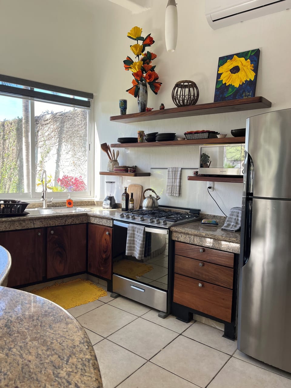 Spacious kitchen with needed supplies for preparing meals during your stay.