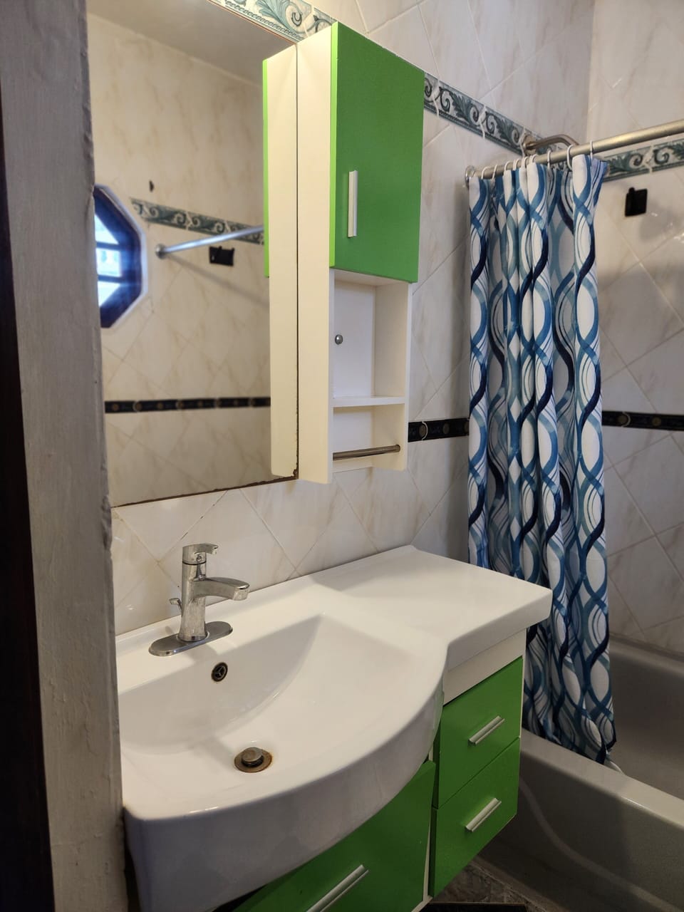Bathtub, towels, soap, toilet paper