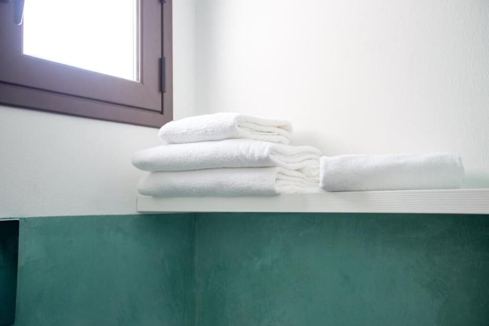 Deluxe Double Room, Balcony, Partial Sea View | Bathroom | Shower, hair dryer, bidet, towels