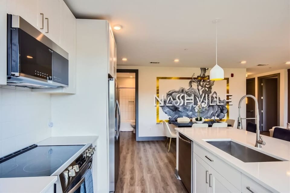 Kitchen: Modern elegance with sleek appliances and vibrant Nashville vibes, perfect for culinary adventures!