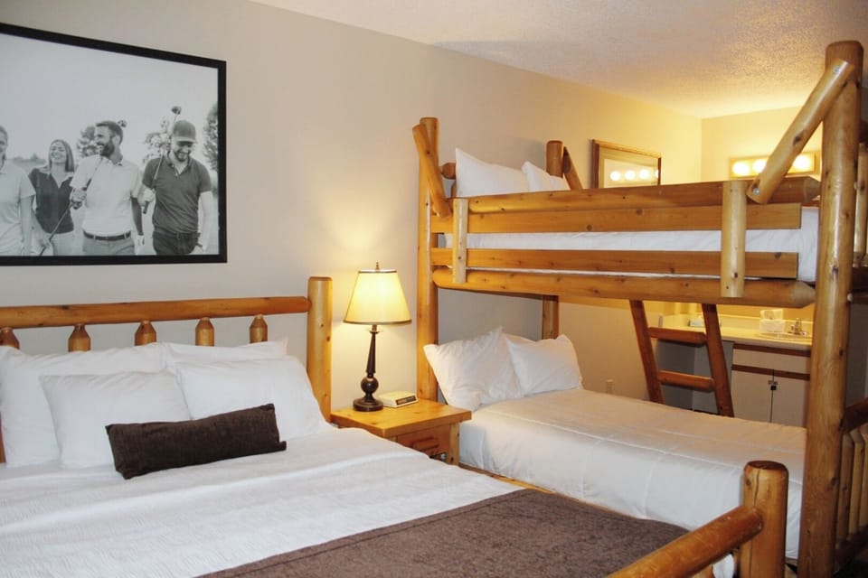 Gather everyone comfortably with log beds and bunks.