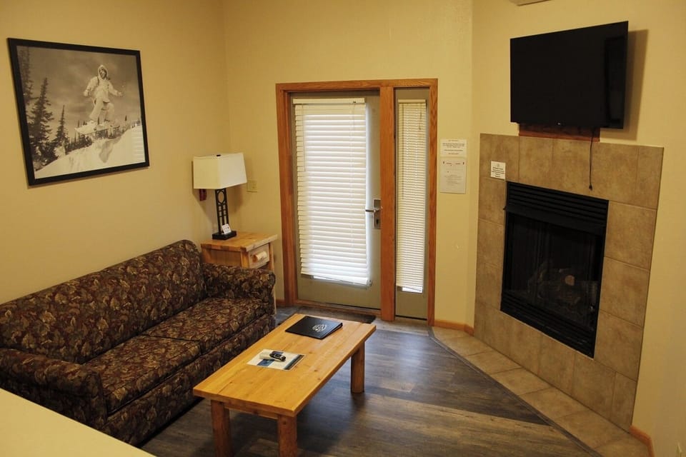 Cozy up by the fireplace after a day of adventures.