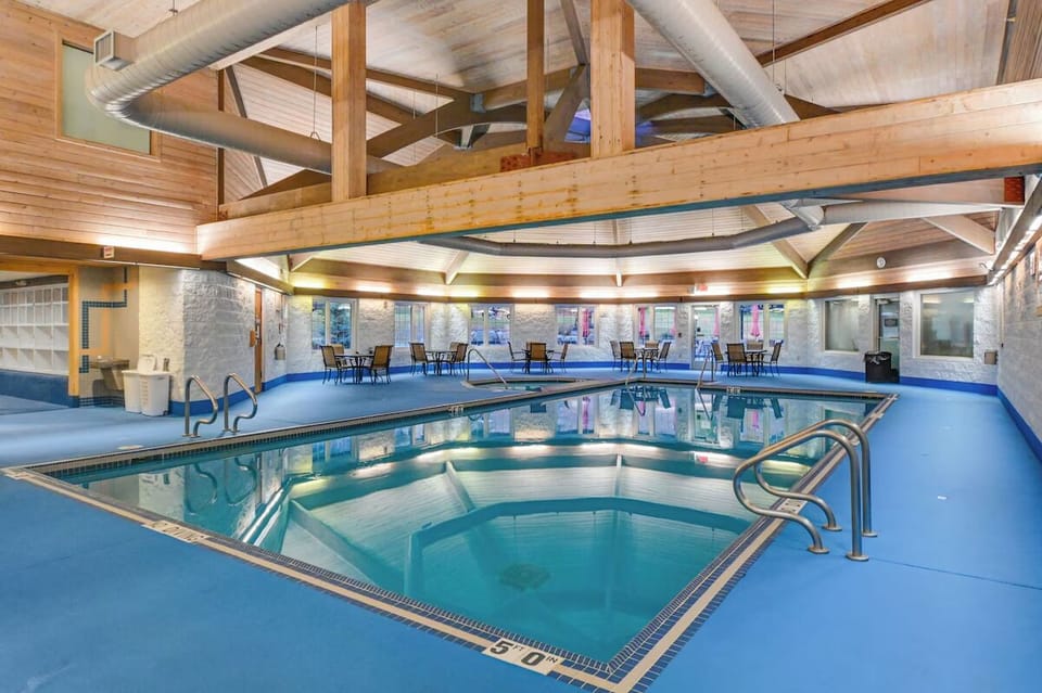 Dive into a bright indoor pool retreat, year-round comfort.