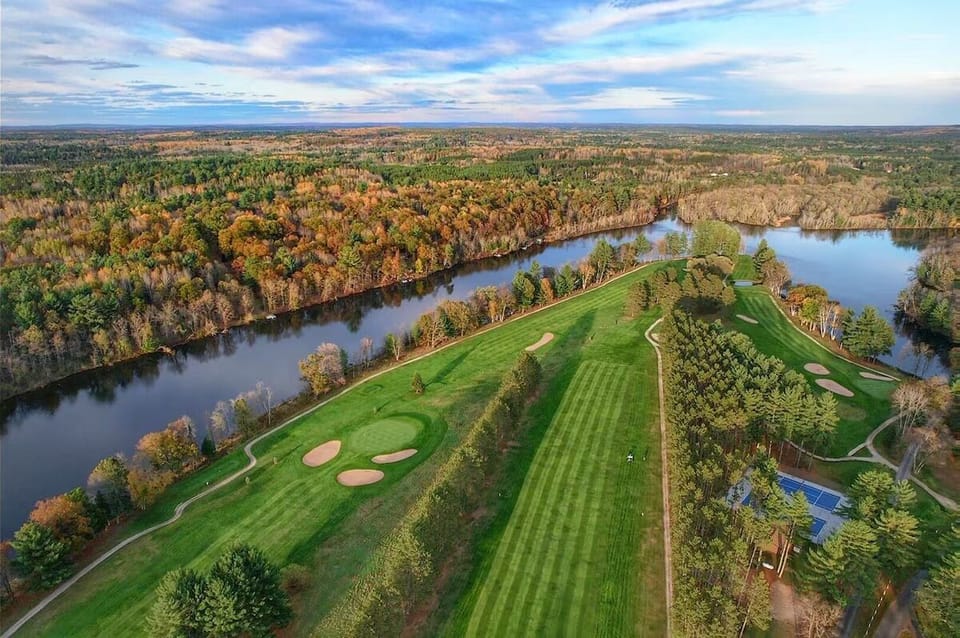 Soar above riverside fairways and savor the resort-like setting.