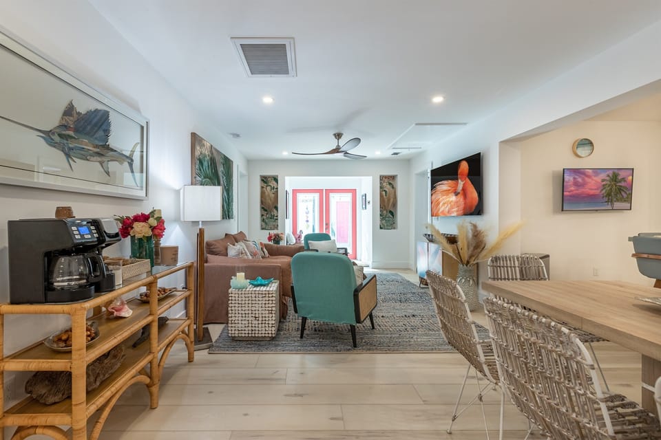 Living Room: Bright and inviting space with vibrant decor and lush views beckoning relaxation!