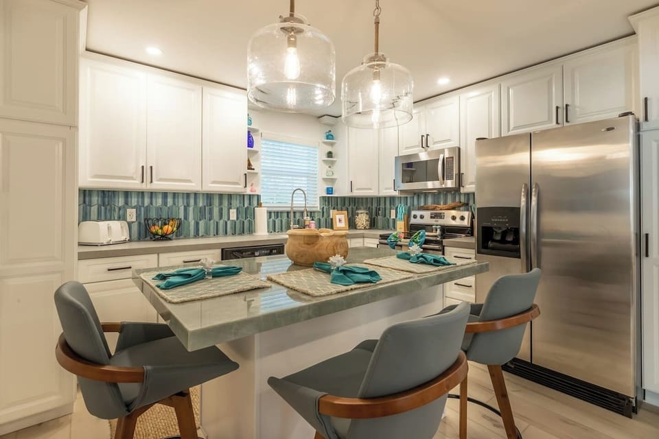 Kitchen: Bright and inviting, perfect for culinary adventures with chic decor and modern appliances!