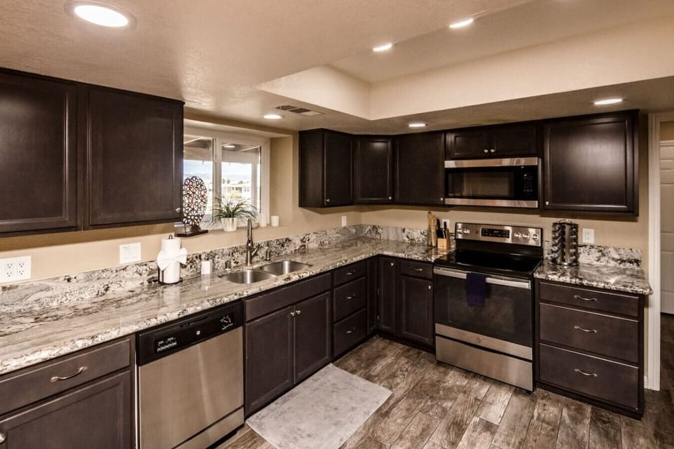 Kitchen with 12 cup coffee maker + Keurig coffee maker.