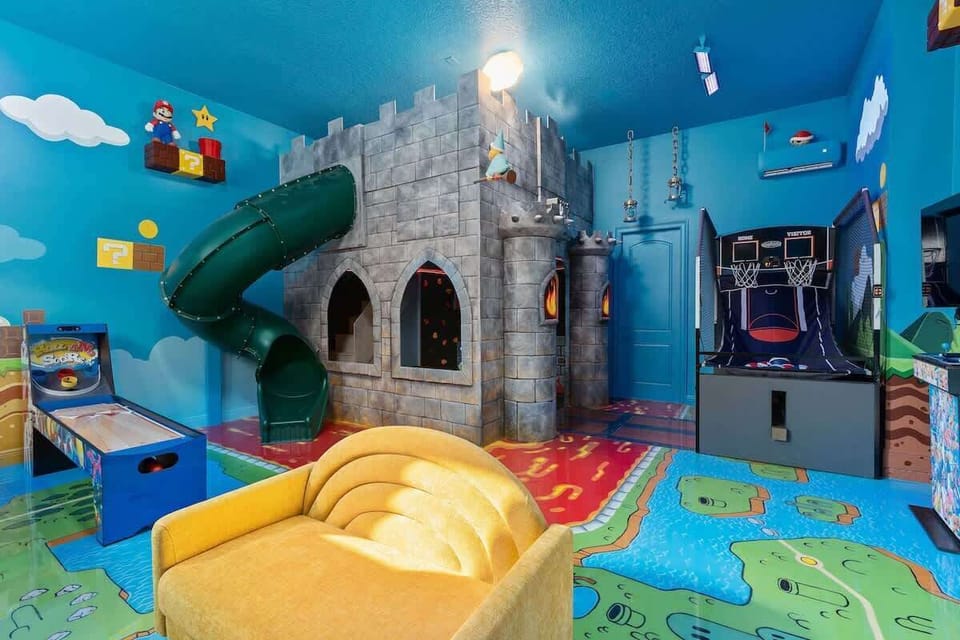 Epic Mario-themed game room featuring Bowser's castle  with spiral slide and hideout. Muraled walls with iconic elements, floating blocks, and cloud details. Air Hockey, skee-ball, Nintendo Switch with Smart TV. Ultimate Nintendo adventure space.