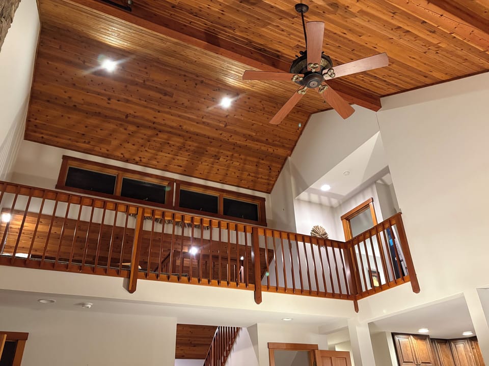 view of upper level loft space from living room