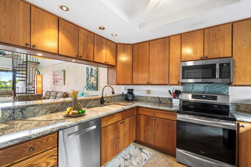 Fully equipped with granite countertops, stainless steel appliances, and all the essentials for your culinary needs.